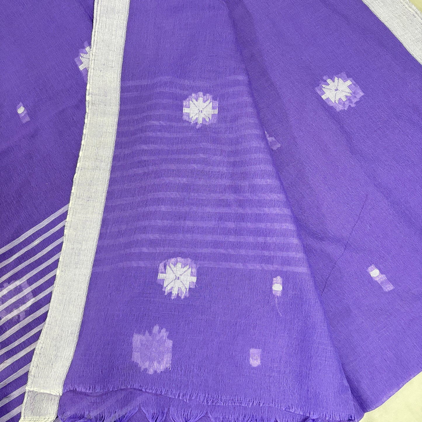 Purple saree with white floral patterns on a yellow background