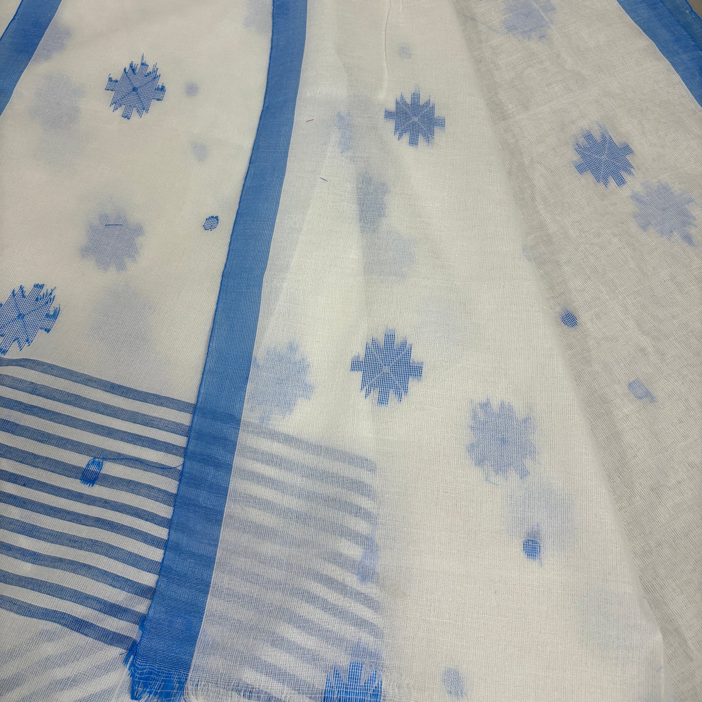 White saree with blue floral patterns and borders
