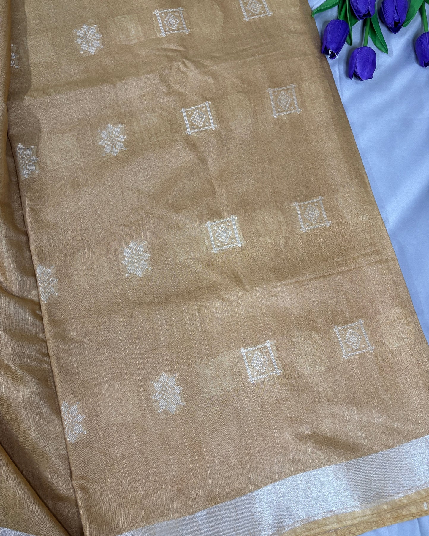yellow fabric with white patterns on a white background
