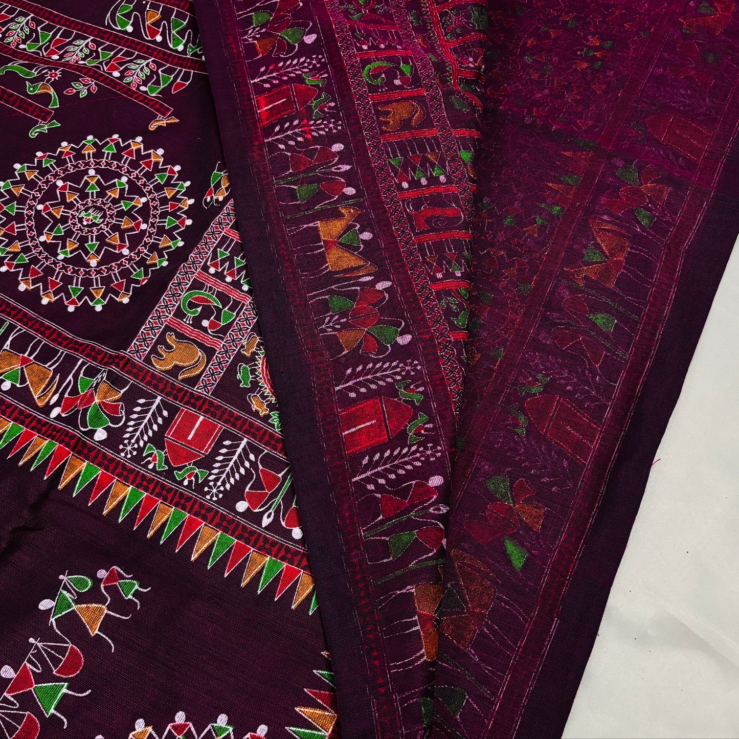 Close-up of a purple madhubani printed saree 