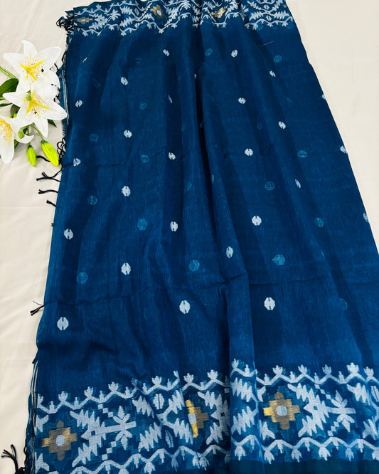 Blue jamdani saree with white patterns on a white background